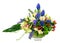 Bouquet from orchids and other flowers in glass vase isolated.