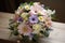 a bouquet of pastel flowers, arranged with delicate precision