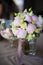 bouquet of pink flowers stands in a glass vase, flowers in buds, fresh flowers