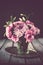 Bouquet of pink flowers in vase vintage decor