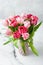Bouquet of pink peony tulips in vase