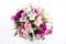 Bouquet from pink and purple gillyflowers and alstroemeria on white background