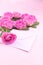 Bouquet of pink roses on the blue style in the interior. Surprise in the women`s holiday. Card with flowers