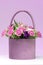 Bouquet of pink roses in a box / basket lilac.