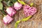 Bouquet of pink roses and a wicker heart with decorations on the table-a concept of love and congratulations for a loved one