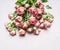 Bouquet of pink shrub roses, a gift on March 8 on wooden rustic background top view