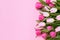 Bouquet of pink tulips on pink background. Mothers day, Valentines Day, Birthday celebration concept. Copy space, top view