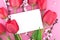 Bouquet of pink tulips and spring flowers on pink background