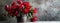 a bouquet of red peonies arranged in an iron bucket, positioned on a table against a serene gray background, leaving