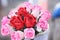 Bouquet of red and pik rose artificial  flowers ,  made from sa pape or mulberry paper background