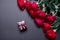 Bouquet of red roses and brown jewelery box on black colored paper background, with copy space