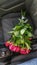 Bouquet of red roses on a car seat