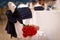 Bouquet of red roses on a chair. a gift at the wedding. flowers as a gift. wedding decoration of the restaurant