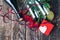 Bouquet of red roses, two glasses, bottle of wine, gift box with tag on vintage wooden board. Valentines day. Top view.