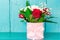 Bouquet of red and white roses on a blue background with copy space