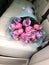a bouquet of roses in the back seat of a car