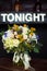 Bouquet of roses and other flowers with `Tonight` sign