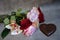 Bouquet of roses, toys and chocolate in the shape of a heart, still life