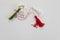 Bouquet of snowdrops and Martisor red and white dalls on shining white background. Holiday Martisor and Baba Marta