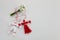 Bouquet of snowdrops and Martisor red and white dalls on shining white background. Holiday Martisor and Baba Marta