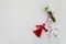 Bouquet of snowdrops and Martisor red and white dalls on shining white background. Holiday Martisor and Baba Marta