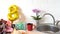 Bouquet of spring flowers and golden ballon 8 eight on kitchen table with gift box and breakfast. Light scandinavian style. Mother