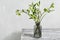 Bouquet of spring hellebore flowers in a vase. Spring floral still life with helleborus flowers. Home natural decoration