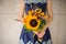 Bouquet sunflowers flower shop female florist holding