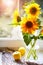 Bouquet sunflowers on sunny window Summery still