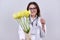 Bouquet of tulip flowers in hands of female doctor with stethoscope