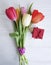 Bouquet of tulips beauty on a white wooden background, gift box