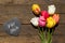 Bouquet of Tulips on a wooden table and a slate with german words for you