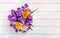 Bouquet of violet, yellow, white crocuses  and flowers hepatica  liverleaf or liverwort  on background of white painted wooden
