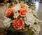 Bouquet of white and orange roses on a table