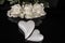 A bouquet of white roses, angels of love and porcelain hearts, Valentine`s Day