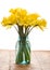 Bouquet of yellow daffodil flowers in a jar