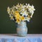 Bouquet of yellow daffodils on the table with a lace tablecloth.