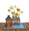 Bouquet of yellow lilies Citronella on blue tray next to an old