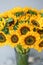 Bouquet of yellow sunflowers , flower in vase on old vintage table. Room morning. Gray background. Colors of autumn and