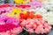 Bouquets of different varieties of roses at a street market. Selling colorful flowers