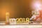 Bouquets of dried flowers, hourglass, wooden plate with letters, February 14, 2018 on wooden table.