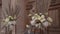 Bouquets of flowers on stands stand on the threshold of the church