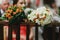 Bouquets of orange and white roses lie on the wooden handrails