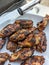 Bourbon and brown sugar marinated wings in blackened seasoning