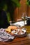 Bourgogne Escargot Snails with herbs butter in enameled baking dish on rustic wooden background.