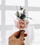 A boutonniere against the background of the bride