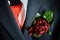 the boutonniere made of dark red peonies on groom\'s suit. preparing for the wedding