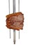 Bovine rump meat steak, traditional brazilian barbecue whole piece on skewer, on white background