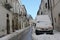 Bovino, Southern Italy - 14.02.2021 Mountain village street with ambulance car covered with snow.