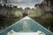 Bow of boat with forward direction towards bank on river in overcast day with dramatic sky symbolizing way forward